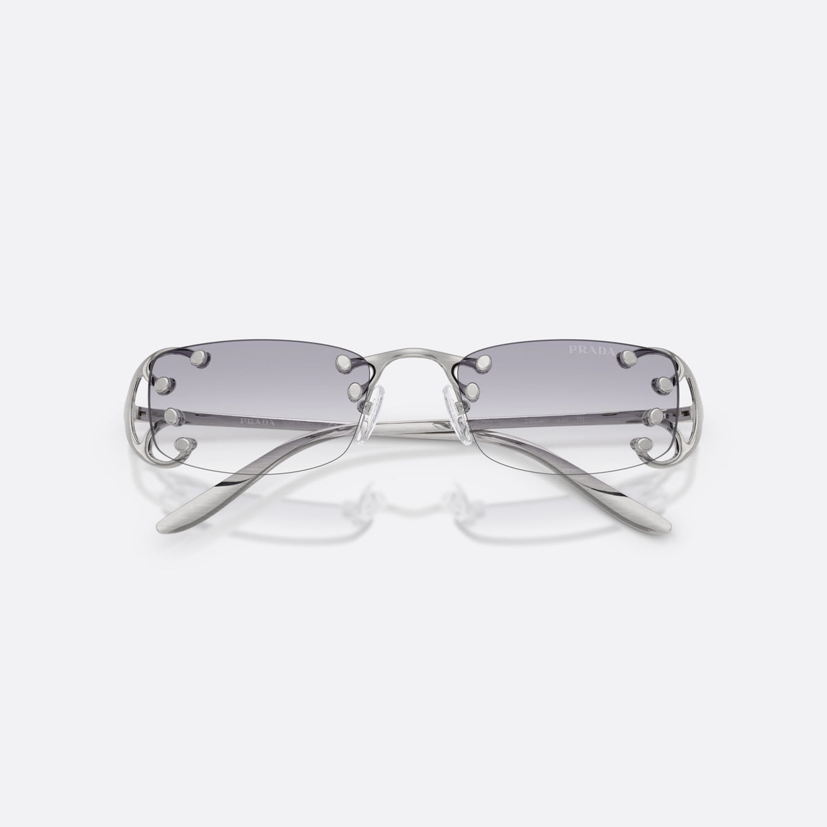 Prada PR C57S 28H40V sunglasses, silver rectangle frame for women, plain metal bridge, brand lettering on temples, folded