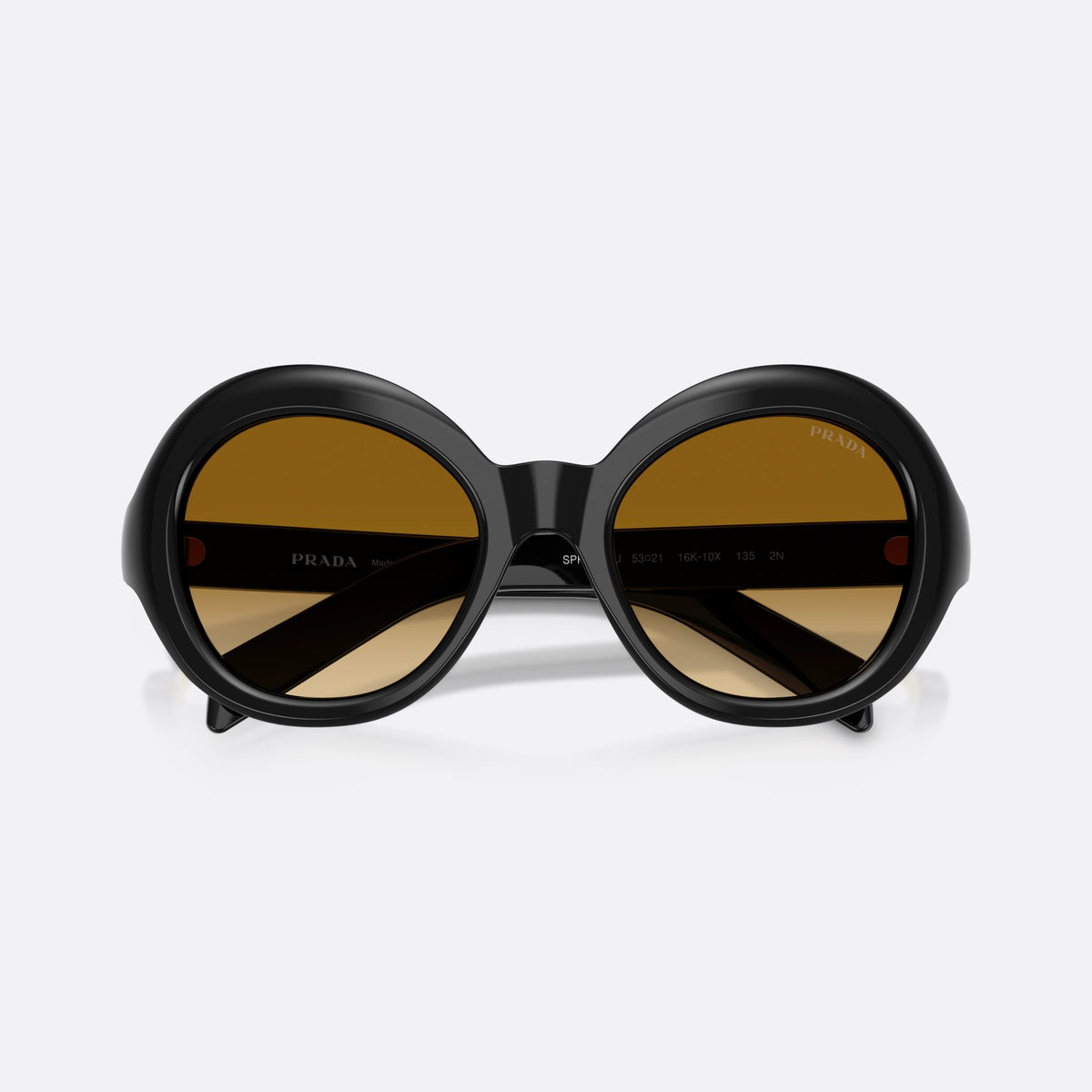 Prada PR D08SU 16K10X sunglasses, black round frame for women, plain bridge, brand lettering on temples, full-rim frame, folded