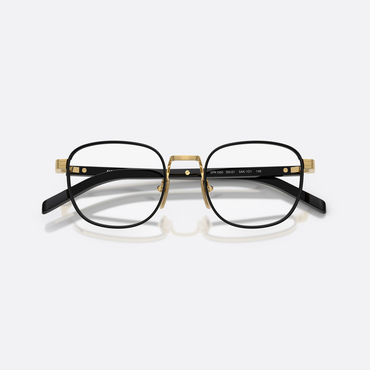 Prada PR D50V 5AK1O1 eyeglasses, black phantos frame for men, plain metal bridge, brand lettering on the temples, folded