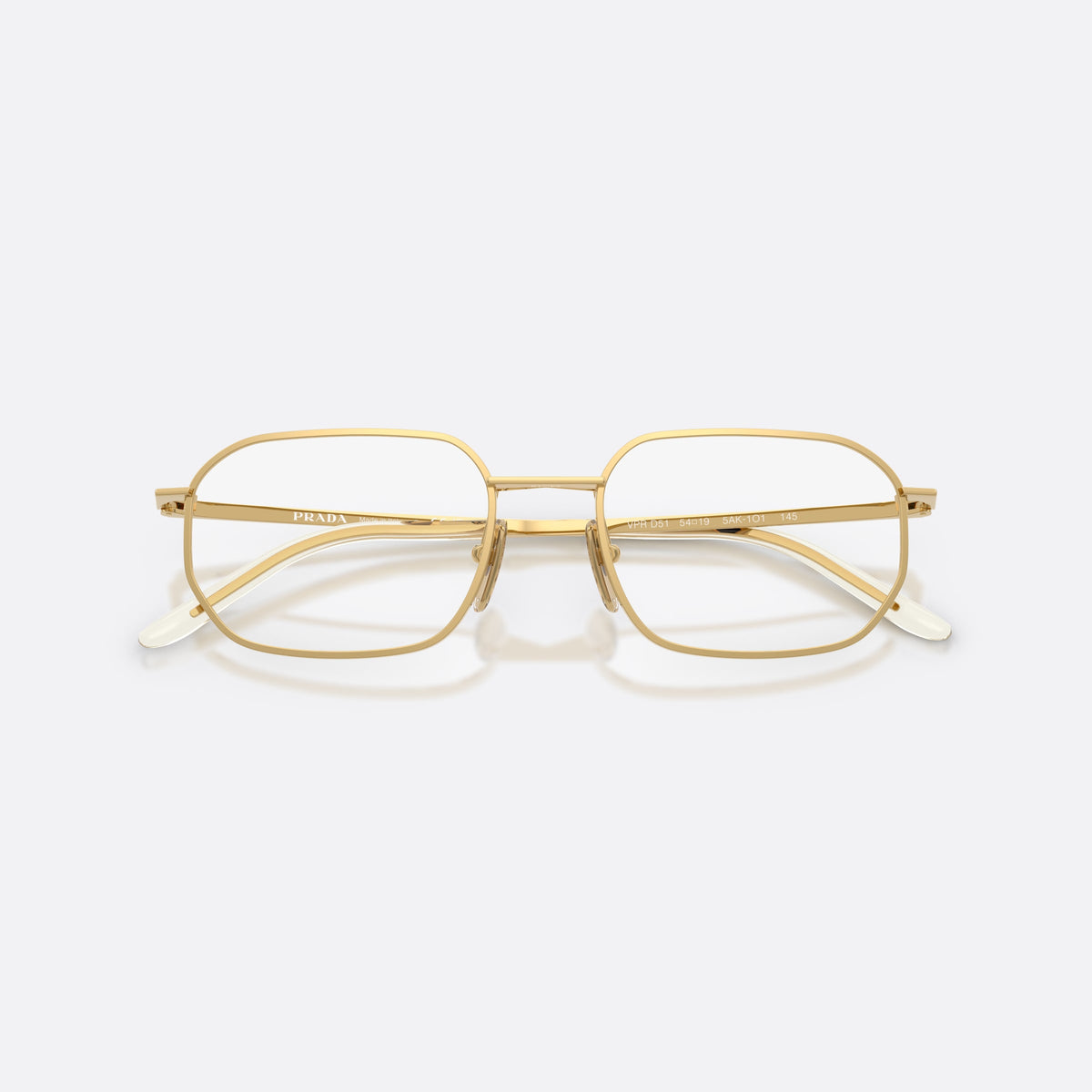 Prada PR D51V 5AK1O1 eyeglasses, gold irregular frame for men, plain metal bridge, brand lettering on temples, folded