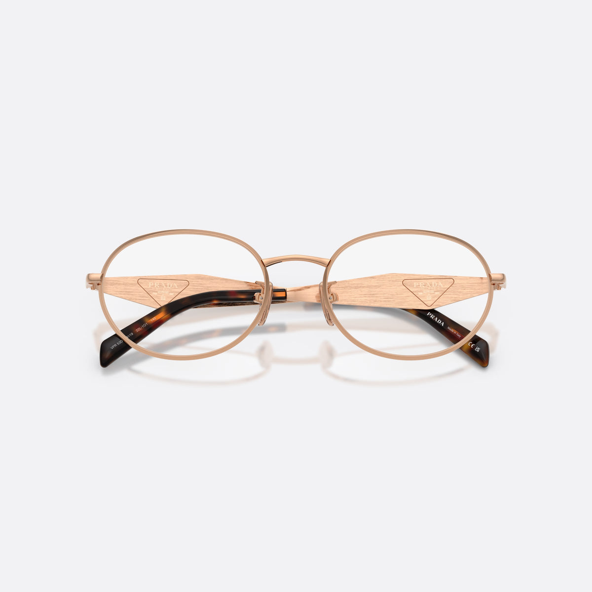 Rame ochelari de vedere Prada PR D53VD 22L1O1, ovali auriu, pentru femei, punte metalică simplă, literele brandului pe brațe, cu brațele pliate