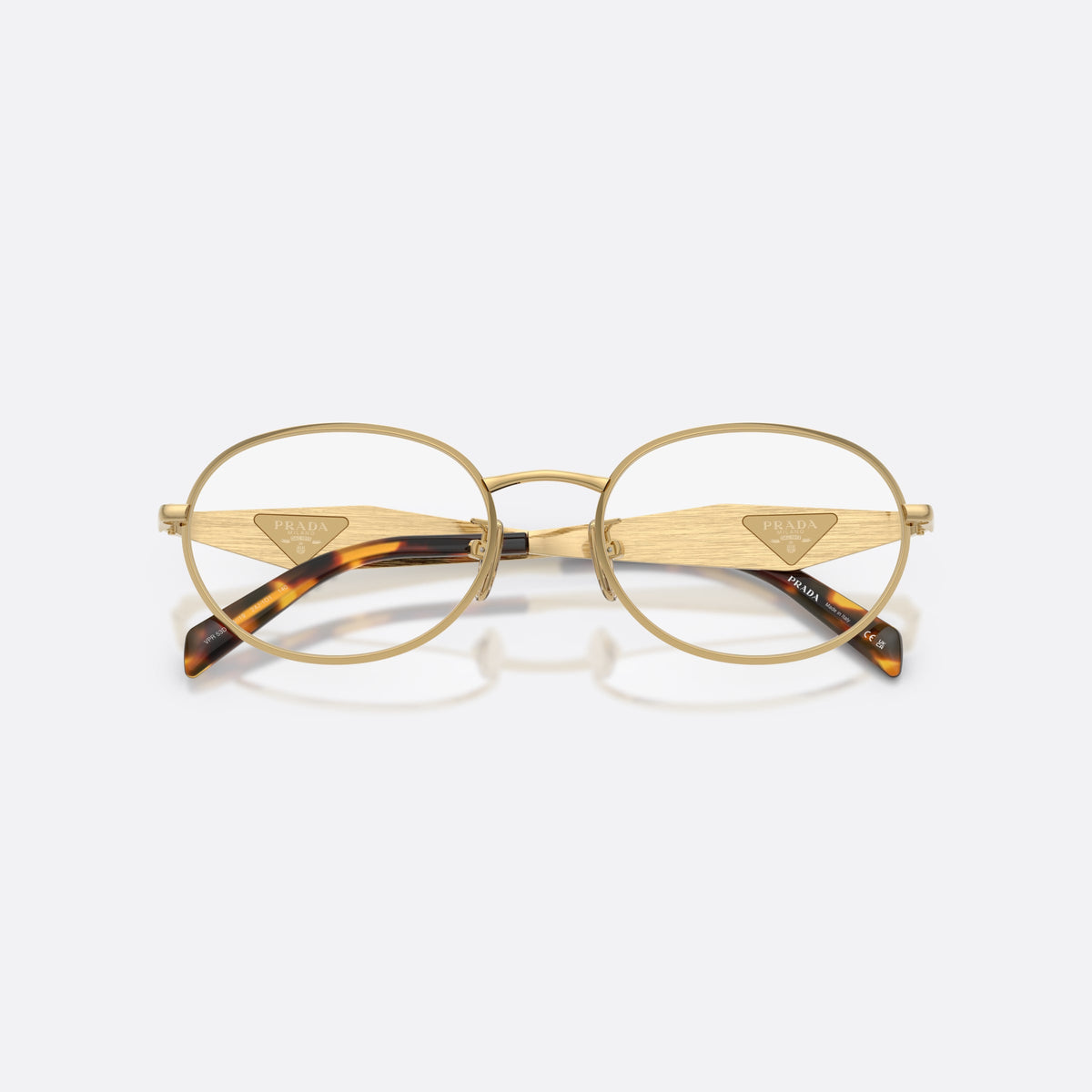 Prada PR D53VD 24J1O1 eyeglasses, gold oval frame for women, plain metal bridge, triangular plaque on temple, folded